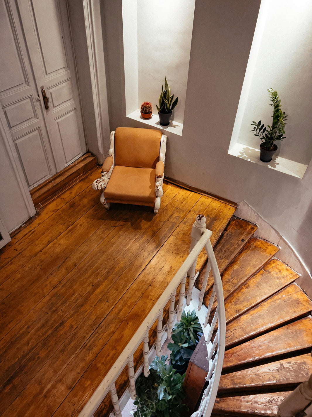 solid hardwood flooring on a staircase looking down the stairs. 