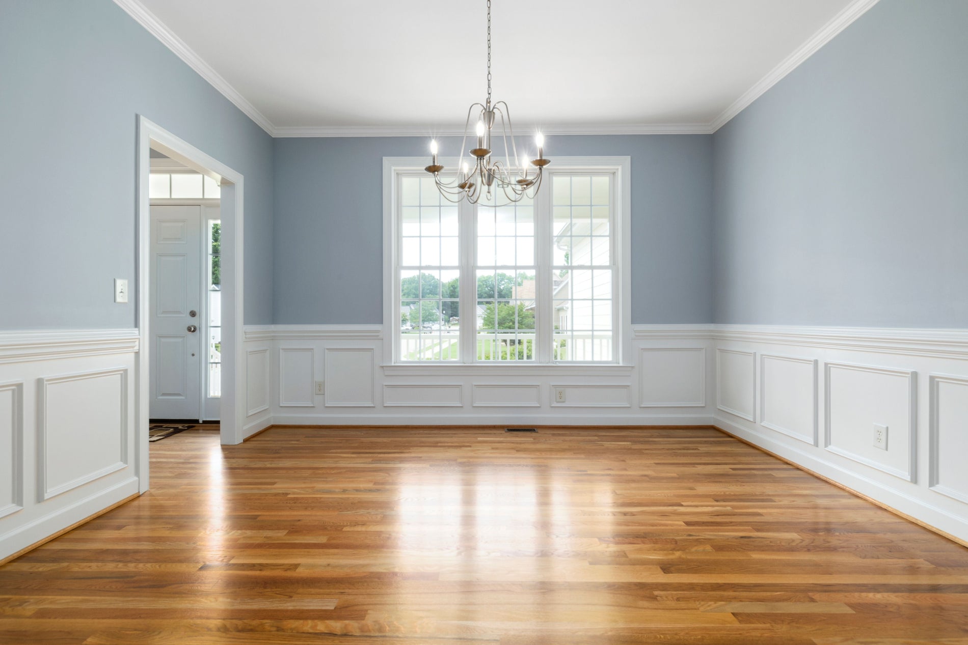 solid hardwood floating flooring in an empty living room