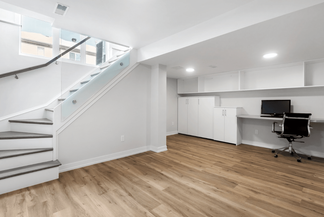 solid floating hardwood flooring in the basement over a concrete slab
