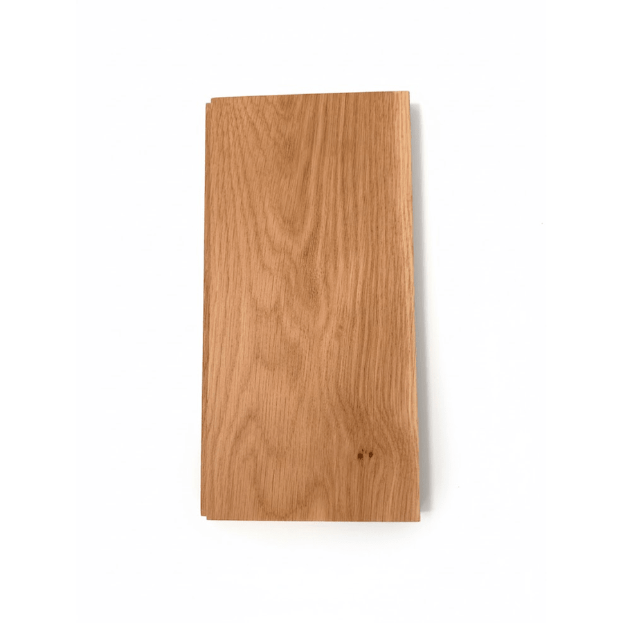 Solid oak hardwood floor plank sample showing natural wood tone and smooth finish