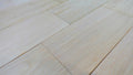 Close-up of Easiklip Unfinished solid white oak hardwood flooring showing pale honey-tan color and natural grain
